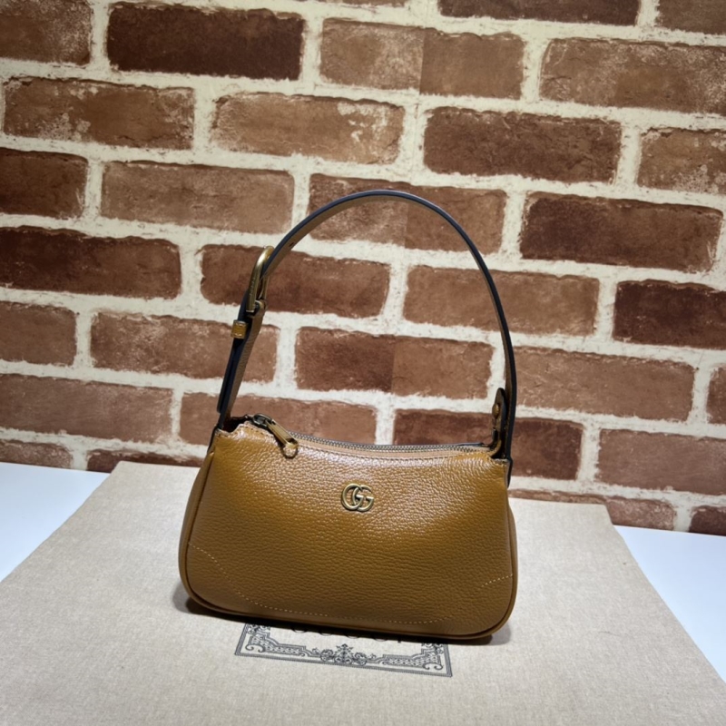 G*u*i top handle bags